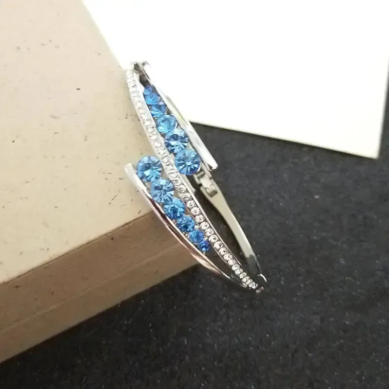 LOVCIA Sterling Silver Blue Crystal Cuff Bracelet for Women – Elegant Hinged Bangle with Sparkling Crystals