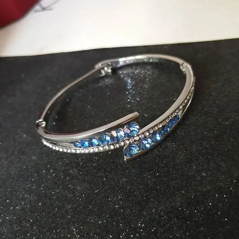 LOVCIA Sterling Silver Blue Crystal Cuff Bracelet for Women – Elegant Hinged Bangle with Sparkling Crystals