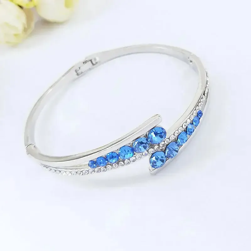 LOVCIA Sterling Silver Blue Crystal Cuff Bracelet for Women – Elegant Hinged Bangle with Sparkling Crystals